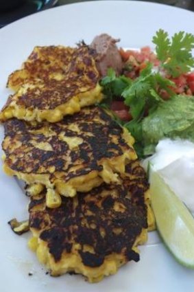 Healthy sized corn fritters with ingredients fit for a tip-top burrito 