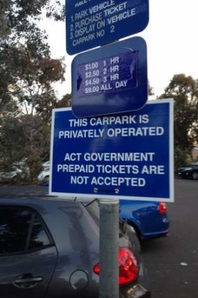 Sign informing drivers of the changes in the carpark's rules.