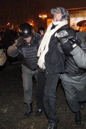 Riot police detain a protester during a demonstration in Moscow.