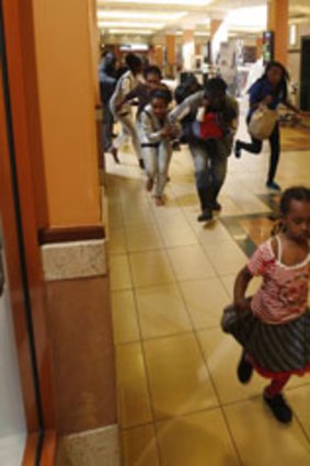 People flee al-Shabab militants in an attack on Nairobi’s Westgate Shopping Mall in 2013.