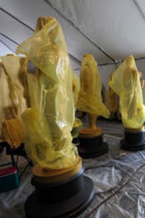 Statues of the Oscars remain in a tent before being transported to the red carpet and Dolby Theatre amid continuing preparations along Hollywood Boulevard.