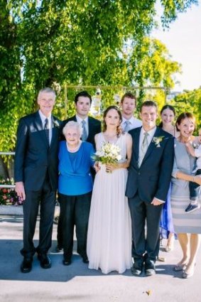 Roger (left) and Jill (holding child) Guard on their son  Paul's wedding day. Amanda is on Paul's left, while David is at the rear next to Roger.