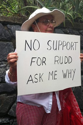 A woman claiming to be an ALP member protested outside Kevin Rudd's home.