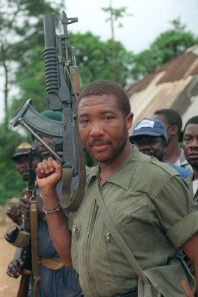 Then rebel leader Charles Taylor, photographed in May 29, 1990 holding his Soviet-made AK-47 assault rifle.