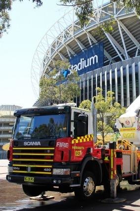 Firefighters perform a routine training exercise against a chemical or powder attack at ANZ Stadium on Thursday afternoon.