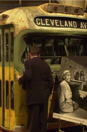 A visitor to the Henry Ford Museum looks inside the actual bus on which civil rights pioneer Rosa Parks refused to give up her seat to a white man in in 1955.