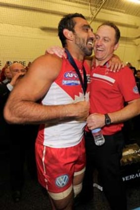 Sydney's Adam Goodes celebrates with John Longmire after the 2012 grand final.