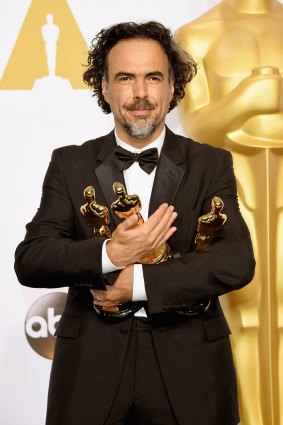 Director Alejandro Gonzalez Inarritu with his Oscars for best original screenplay, best director at best picture for <i>Birdman</i> at the Academy Awards last year.