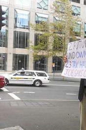 G20 protester Bill Johnstone outside the InterContinental hotel in Sydney's CBD.
