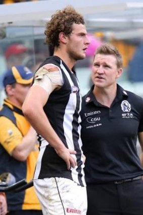 Nathan Buckley with Jarrod Witts during Saturday's game.