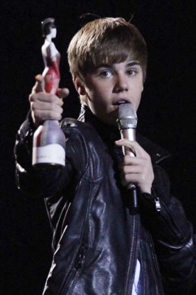 Canadian singer Justin Bieber accepts his best International Breakthrough Act award.