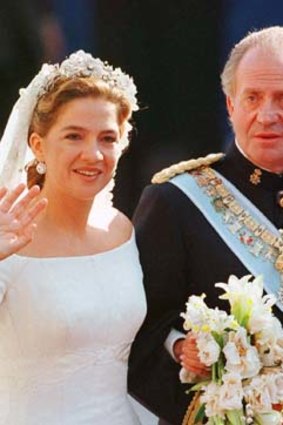 On her wedding day: Princess Cristina and her father King Juan Carlos on 4 October 1997.