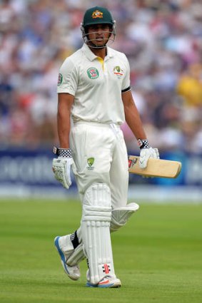 Stunned: Usman Khawaja trudges off after his review failed.
