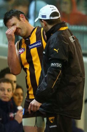 Brent Guerra winces in pain after injuring his hamstring during the round 23 match against the West Coast Eagles.