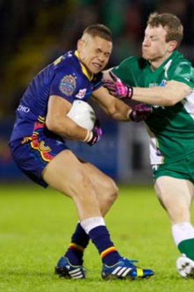 Ireland's Colm Boyle tries to get the ball off Leroy Jetta of Australia during the International rules match on Saturday.