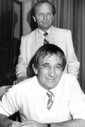 Ian Norman (sitting) and Gerry Harvey at their Norman Ross office at Homebush in 1982.
