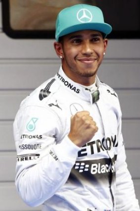 Lewis Hamilton celebrating after taking pole.