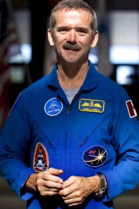 Grounded: Astronaut Chris Hadfield now enjoys tinkering with his boat.