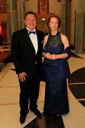 Humour heightened the feelings of edginess ... Julia Gillard and Tim Mathieson arrive at the press gallery's midwinter ball.