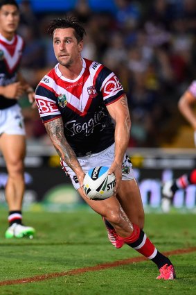 Raring to go: Mitchell Pearce runs the ball in round one.