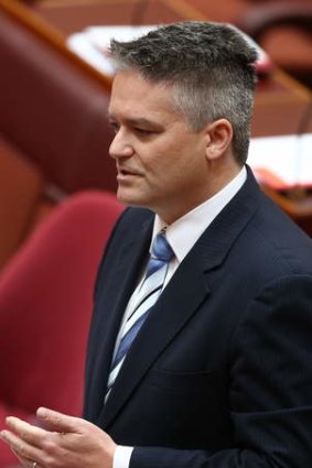 Finance Minister Senator Mathias Cormann speaks on the carbon tax repeal bill in the Senate on Wednesday.