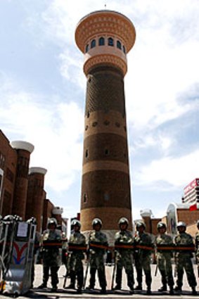 Soldiers guard the Dong Kuruk Bridge mosque in Urumqi.