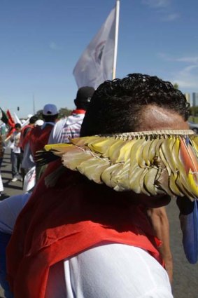 Demonstrators march in Brasilia in protest at the construction of a hydroelectric power plant in the Amazon.