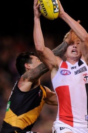 St Kilda's Clinton Jones clashes with Richmond's Aaron Edwards.