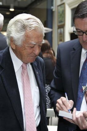 Labor luminaries: former minister Greg Combet signs his book for former prime minister Bob Hawke.