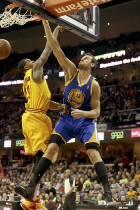 Golden State Warriors centre Andrew Bogut dunks on Cleveland forward Tristan Thompson.