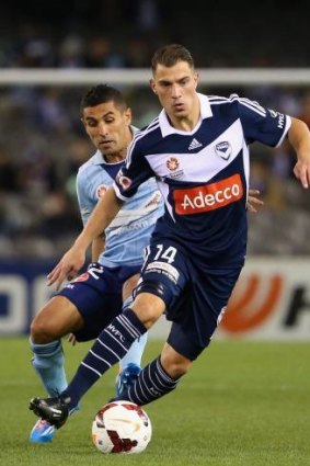 James Troisi attempts to deceive Ali Abbas of Sydney FC during the A-League elimination final on the weekend.