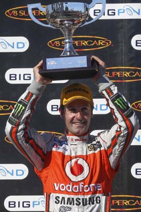 It's all mine: Whincup holds up his trophy yesterday.