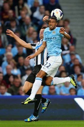 Gael Clichy of Manchester City clashes with Mathieu Debuchy of Newcastle United.