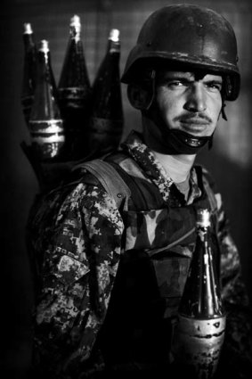 Portrait of a soldier ... members of the Afghan National Army following a patrol in the Arghandab Valley.