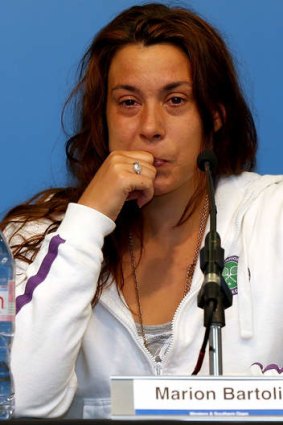Marion Bartoli announces her retirement at a press conference.
