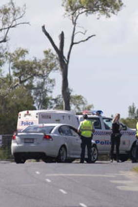 Police at the entrance at the scene of a light plane crash at Caboolture Airport.