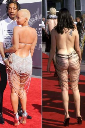 Amber Rose, left, in a slightly more demure nod to Rose McGowan's 1998 VMA 'dress'.