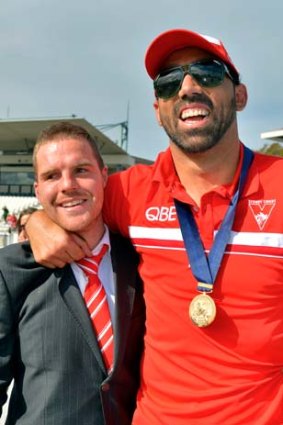 Warm embrace ... Adam Goodes includes Ben McGlynn in the celebrations with fans at Lakeside oval yesterday.