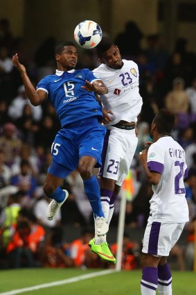 In dispute: Al-Hilal forward Nasser Al-Shamrani (left) contests the ball in his side's ACL semi-final against Al Ain.