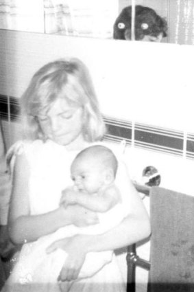 Tizzie, aged seven, is pictured with her brother Richard, who died of SIDS when he was eight weeks old.