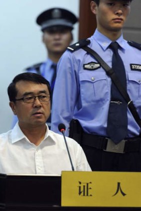 Former police chief of Chongqing municipality Wang Lijun speaks as witness at a court where ousted Chinese politician Bo Xilai is standing trial.