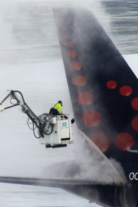 A plane is de-iced at Belgium's Zavantem airport.