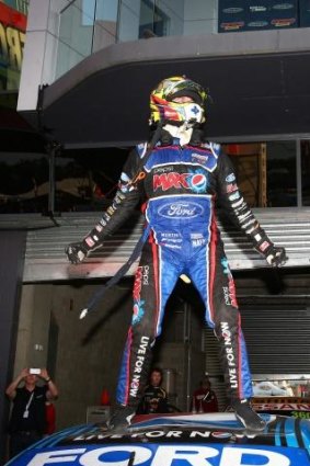 On top of the world: Chaz Mostert celebrates his win.