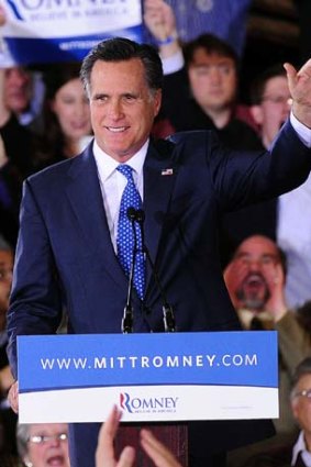 Mr Romney celebrates in Boston.