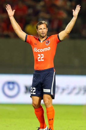 Up in arms: Lucas Neill playing for J-League club Omiya Ardija.