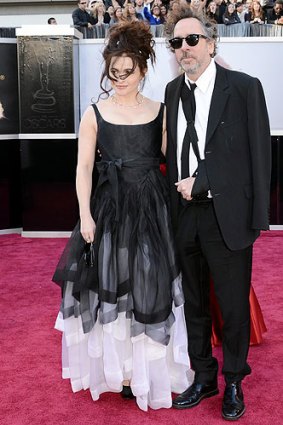Director Tim Burton wore a sling and seemed to take his cue on hairstyle from actress wife Helena Bonham-Carter.