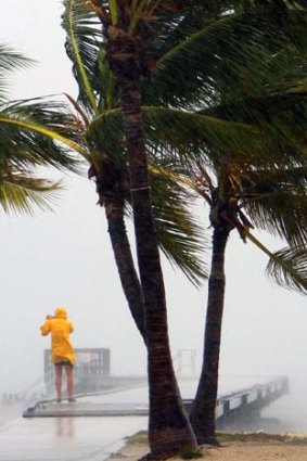 Routine ... a person braves tropical storm Isaac in Key West, Florida.