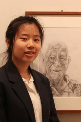 Winner, ages 16-18L Angela Yang, 17, with her portait of her neighbour.