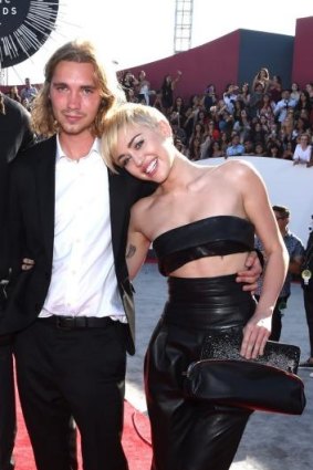 Miley Cyrus with her mystery date, Jesse Helt, who is a homeless man from Salem, Oregon.