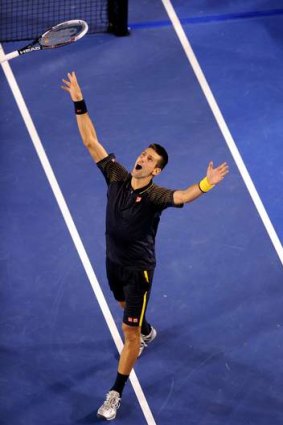 Novak Djokovic celebrates his third Australian Open victory.